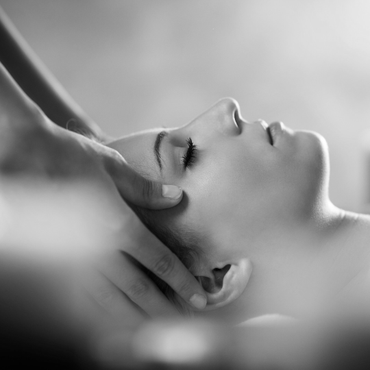 woman having a winter warmer massage and looking relaxed