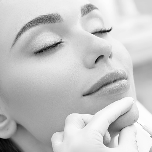 woman getting dermal fillers in her chin