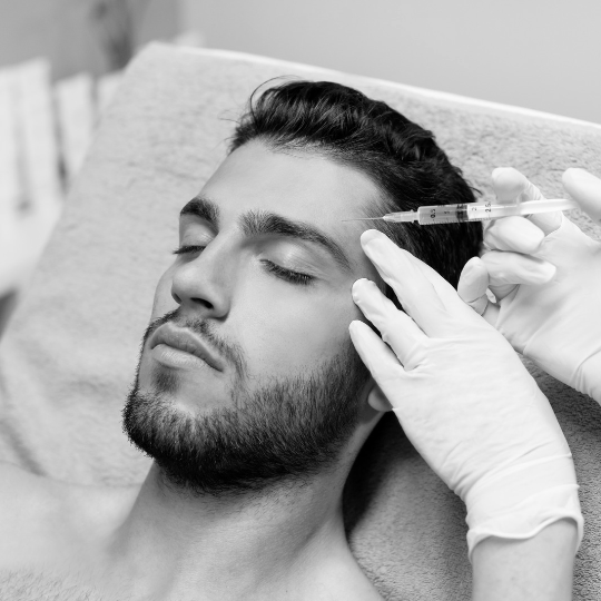 man getting dermal filler in his forehead